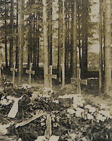 A view towards a section of the War Cemetery in Nunkirchen during winter 1944/45 at several wooden cross grave marker located within the pinewood forest along the road L-152.