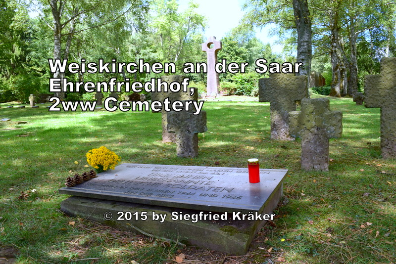  A view during one summer morning from inside the war cemetery in Weiskirchen towards the Comrades-Grave of the unknown soldier which is located between the graveyard area 1 and 2 inside of the war cemetery and contains the remains of 54 unknown German soldiers who lost their lives in the years 1944 - 1945 on the small river Blies. 